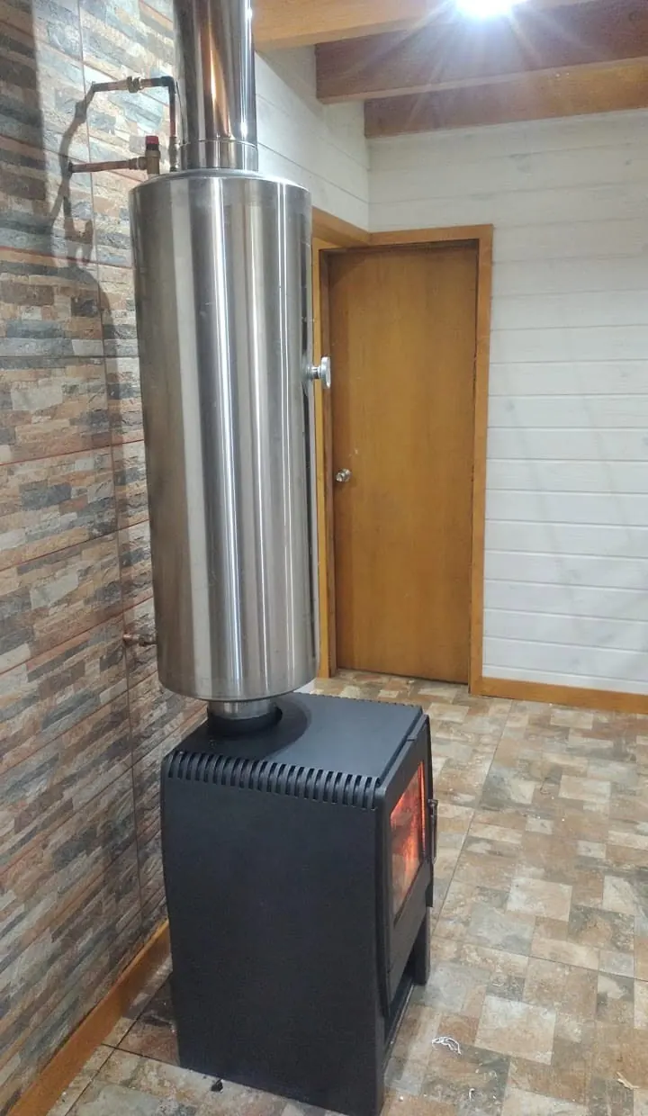 Termocañón instalado sobre una estufa de combustión lenta